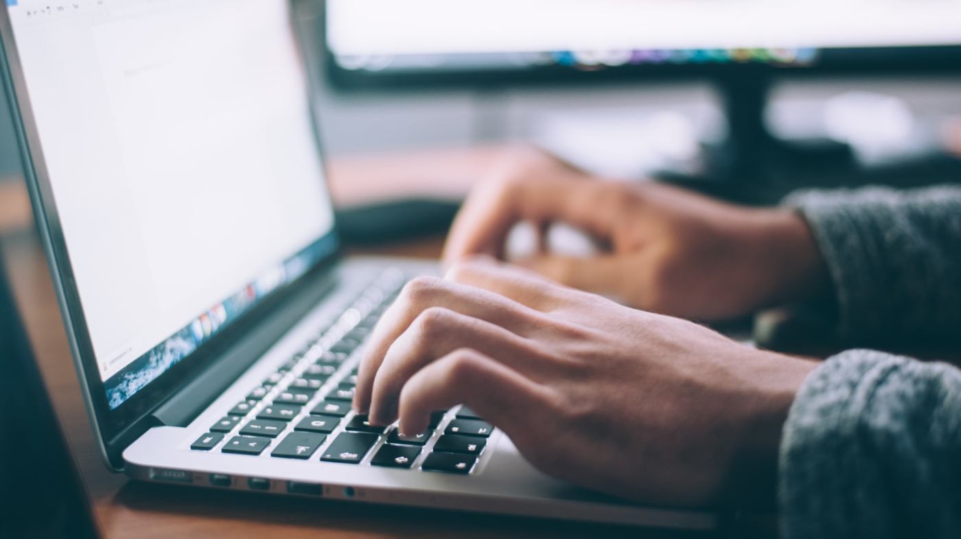 A person is working on a laptop.